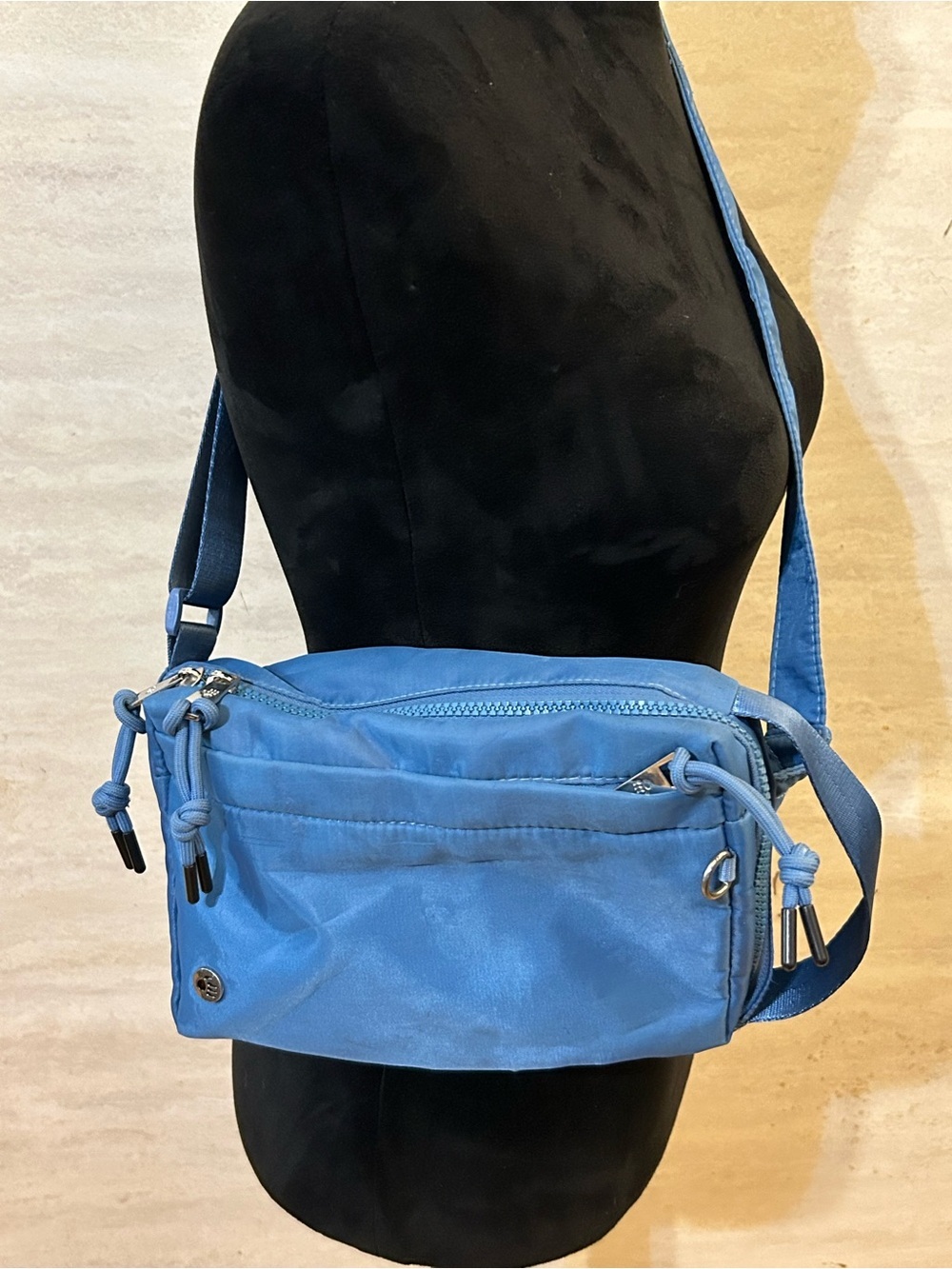 Bearpaw Nylon Sling
Convertible Crossbody Bag in a slate blue colorway.